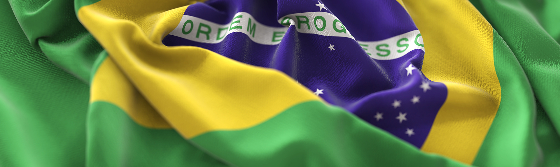 brazil-flag-ruffled-beautifully-waving-macro-close-up-shot 1